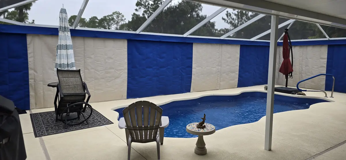 Tan roller shades on patio